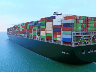 shipping-34900412_container-ship-in-import-export-and-business-logistics-by-crane-trade-port-shipping-cargo-to-harbor-international-transportation-business-logistics-concept